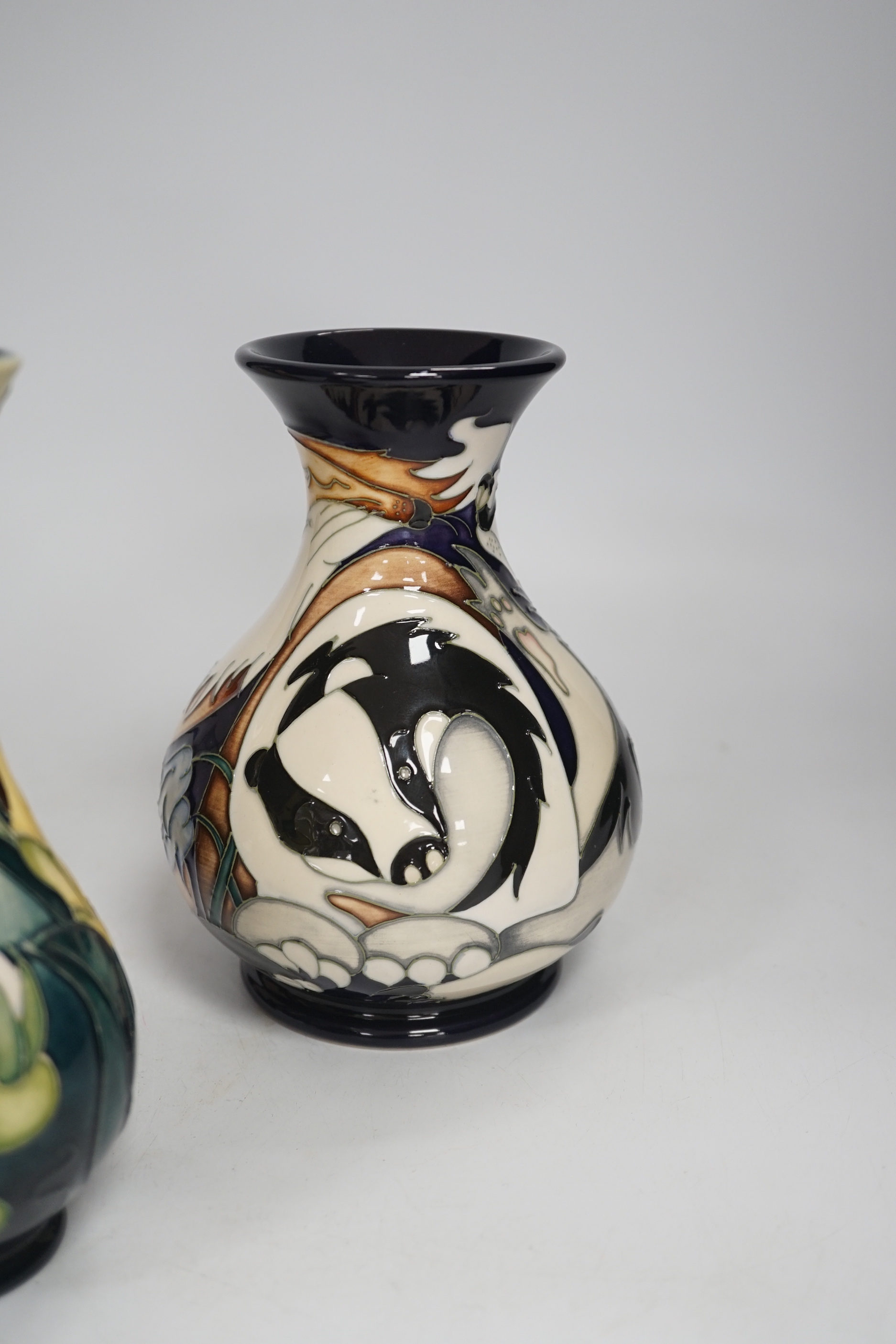 Three Moorcroft vases - a trial vase by Philip Gibson, another trial vase and a ‘Harebell Wood’ limited edition vase by Emma Bossons 2/3, largest 25cm high